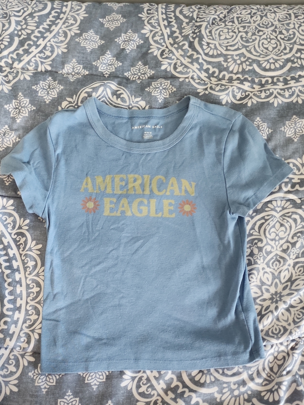 American Eagle Outfitters Light Blue Tee with Yellow Logo and Orange Flowers M
